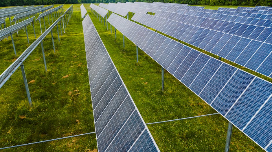 Aerial view of solar panels in a green field, Rossville, GA.